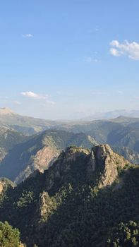 Scenic view of a mountain range under a clear blue sky, perfect for nature lovers.