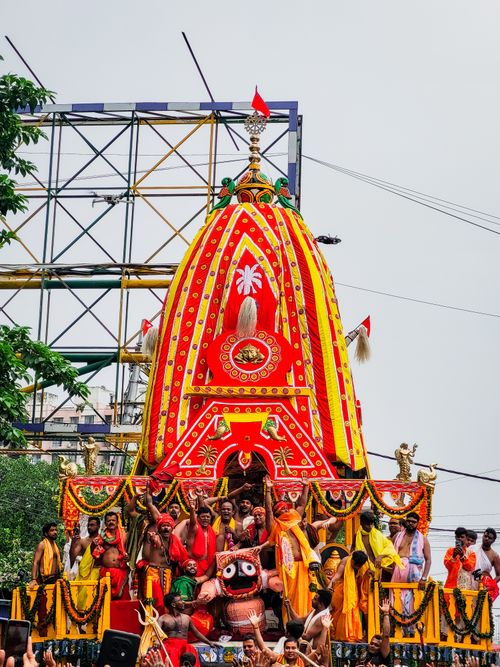 Free Vibrant Ratha Yatra festival parade with devotees and decorated chariot. Stock Photo