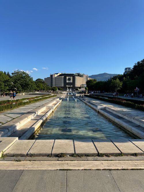 Free View of the National Palace of Culture and fountain in Sofia, Bulgaria during a clear day. Stock Photo