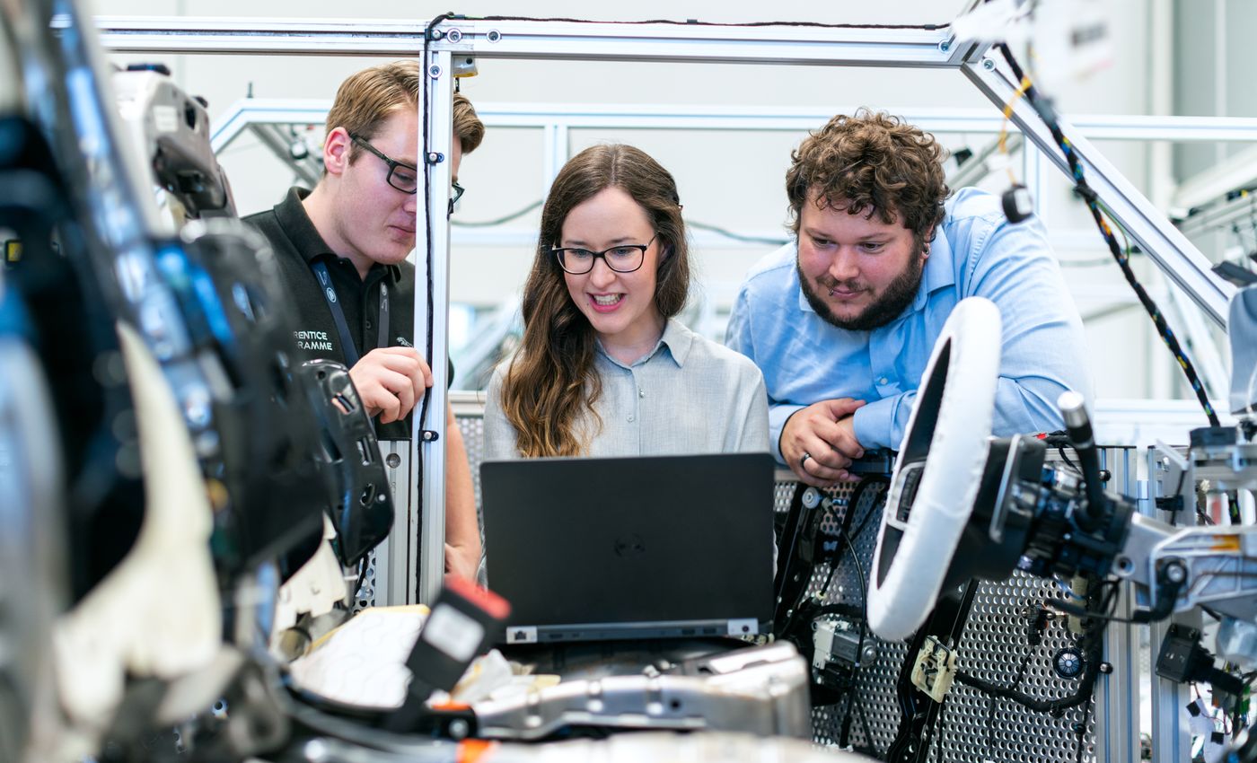 Professionals developing practical workforce skills in a technical training environment