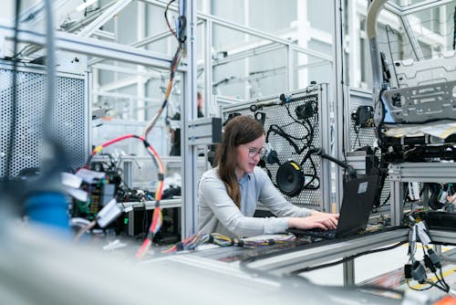 Free Photo Of Female Engineer Working On Her Workspace Stock Photo