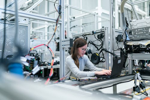 Female Engineer Working in Workshop