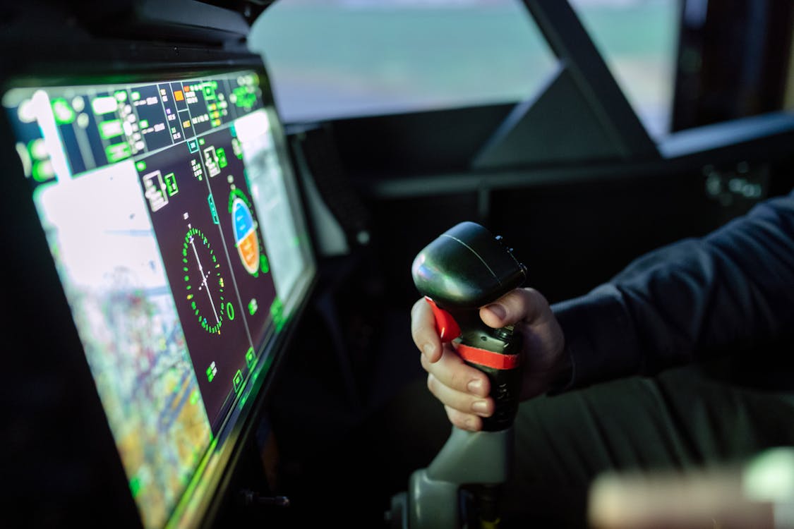 Free Person Controlling Flight Simulator Stock Photo