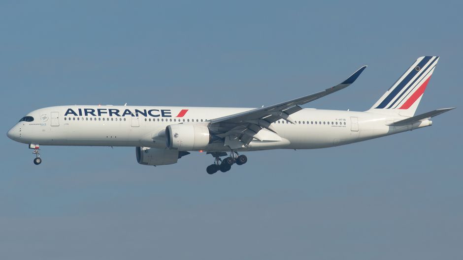 A high-resolution image of an Air France Airbus A350 aircraft flying through a clear blue sky.