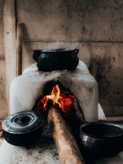 Free Rustic wood-burning stove in Rio Vermelho with pots, showcasing traditional Brazilian cooking. Stock Photo