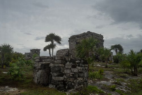 Free Explore the ancient stone ruins and lush greenery under a cloudy sky in this evocative scene. Stock Photo