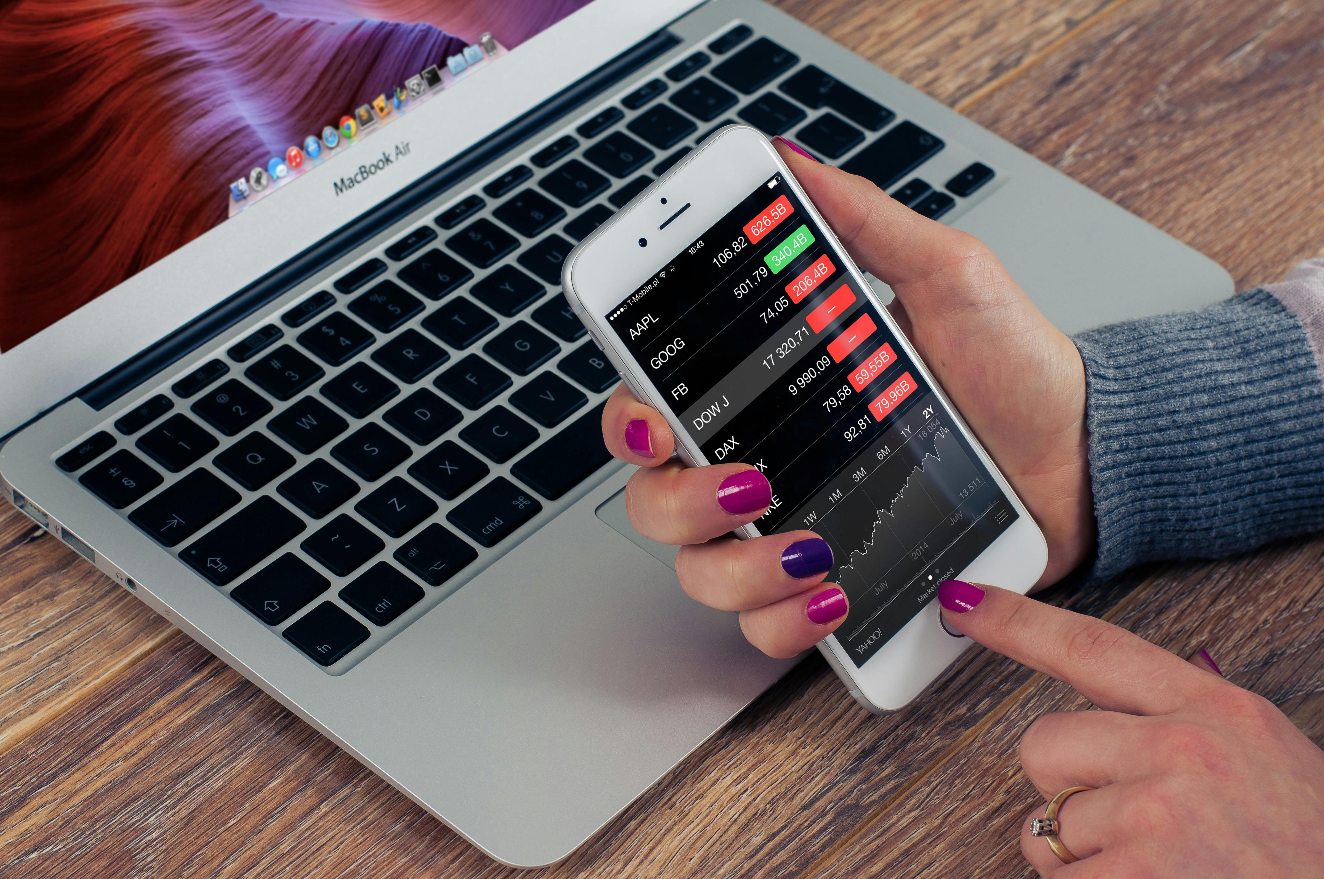 Silver Iphone 6 Plus And Macbook Air On Wooden Table Free Stock Photo