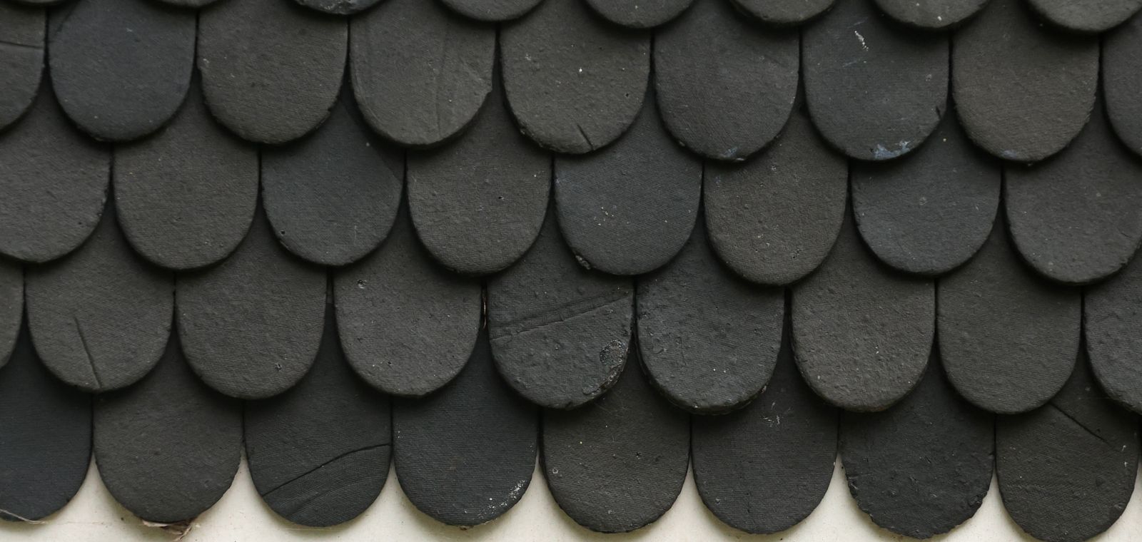 Close-up of black textured asphalt shingles