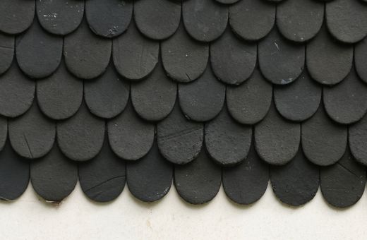 Close-up of black textured asphalt shingles