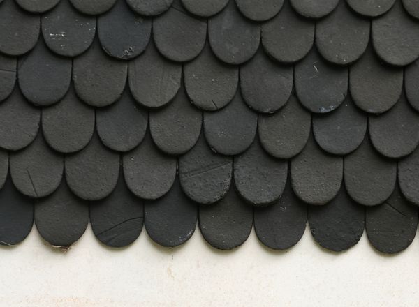 Close-up of black textured asphalt shingles