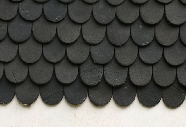 Close-up of black textured asphalt shingles