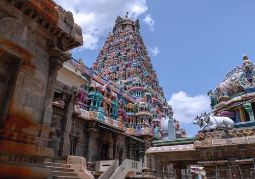 Free Intricate granite temple with vibrant carvings under a clear blue sky in Tamil Nadu, India. Stock Photo