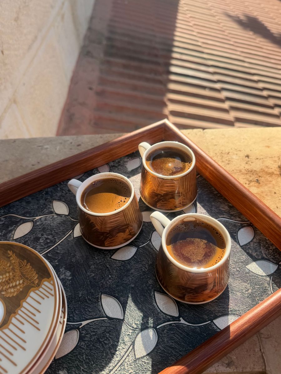 Handmade cups of coffee on a decorated tray