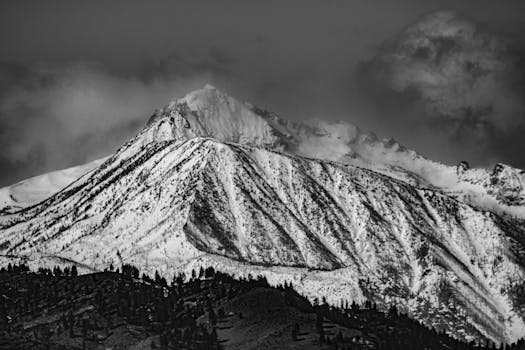 A breathtaking black and white photo of a snow-covered mountain peak in Wenatchee, WA.