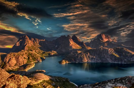 Breathtaking view of Nordland's rugged peaks and tranquil waters at sunset.
