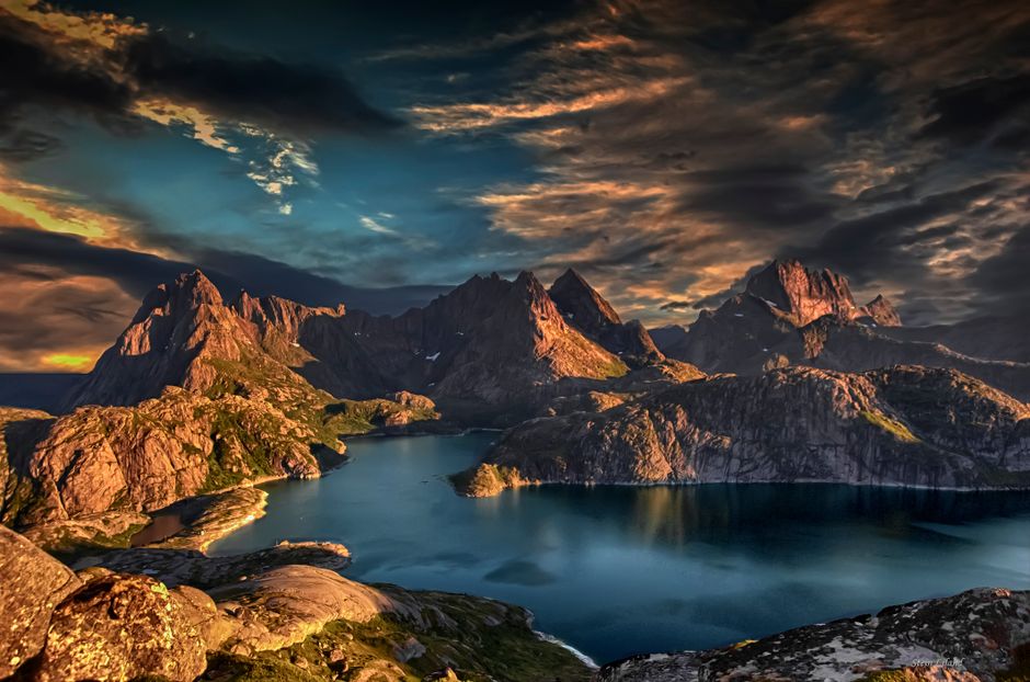 Amazing Tromsø Fjordland Aurora Chase Northern Lights by the Arctic Sea Review 2026 - Breathtaking view of Nordland's rugged peaks and tranquil waters at sunset.