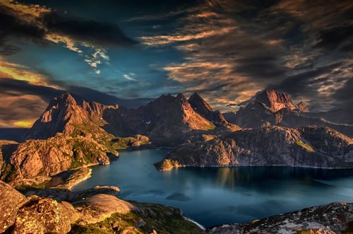 Free Breathtaking view of Nordland's rugged peaks and tranquil waters at sunset. Stock Photo
