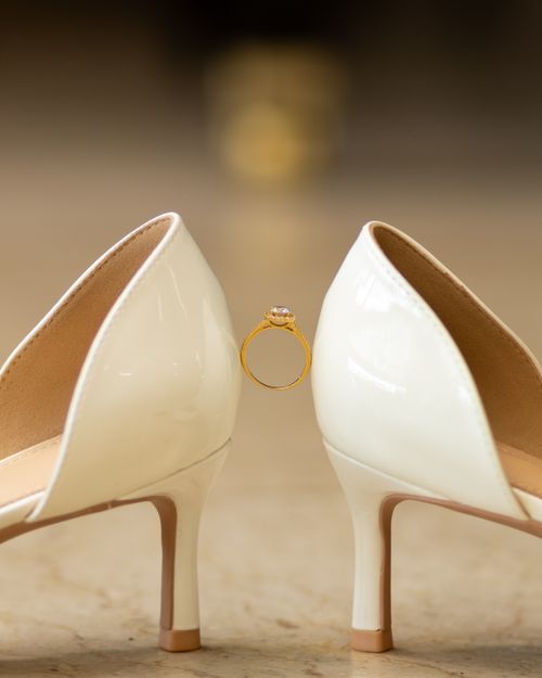 Free Close-up of high heels and engagement ring symbolizing a wedding concept. Stock Photo