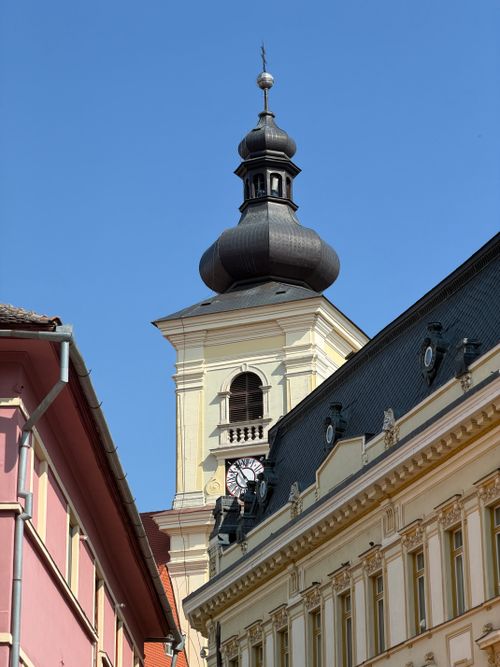 Free Close-up of Sibiu's clock tower showcasing Romanian Baroque architecture under a clear blue sky. Stock Photo