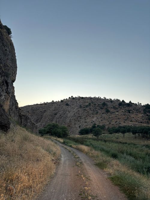 Free A serene dirt path winds through a rocky, mountainous landscape at dusk in Konya, Turkey. Stock Photo