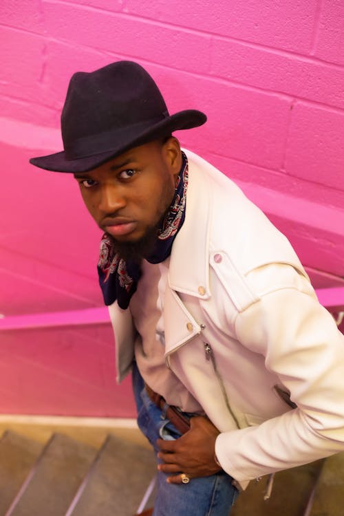 Man in White Jacket And Black Cowboy Hat