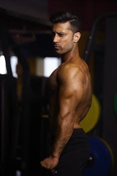 Portrait of a muscular man working out in a gym environment.