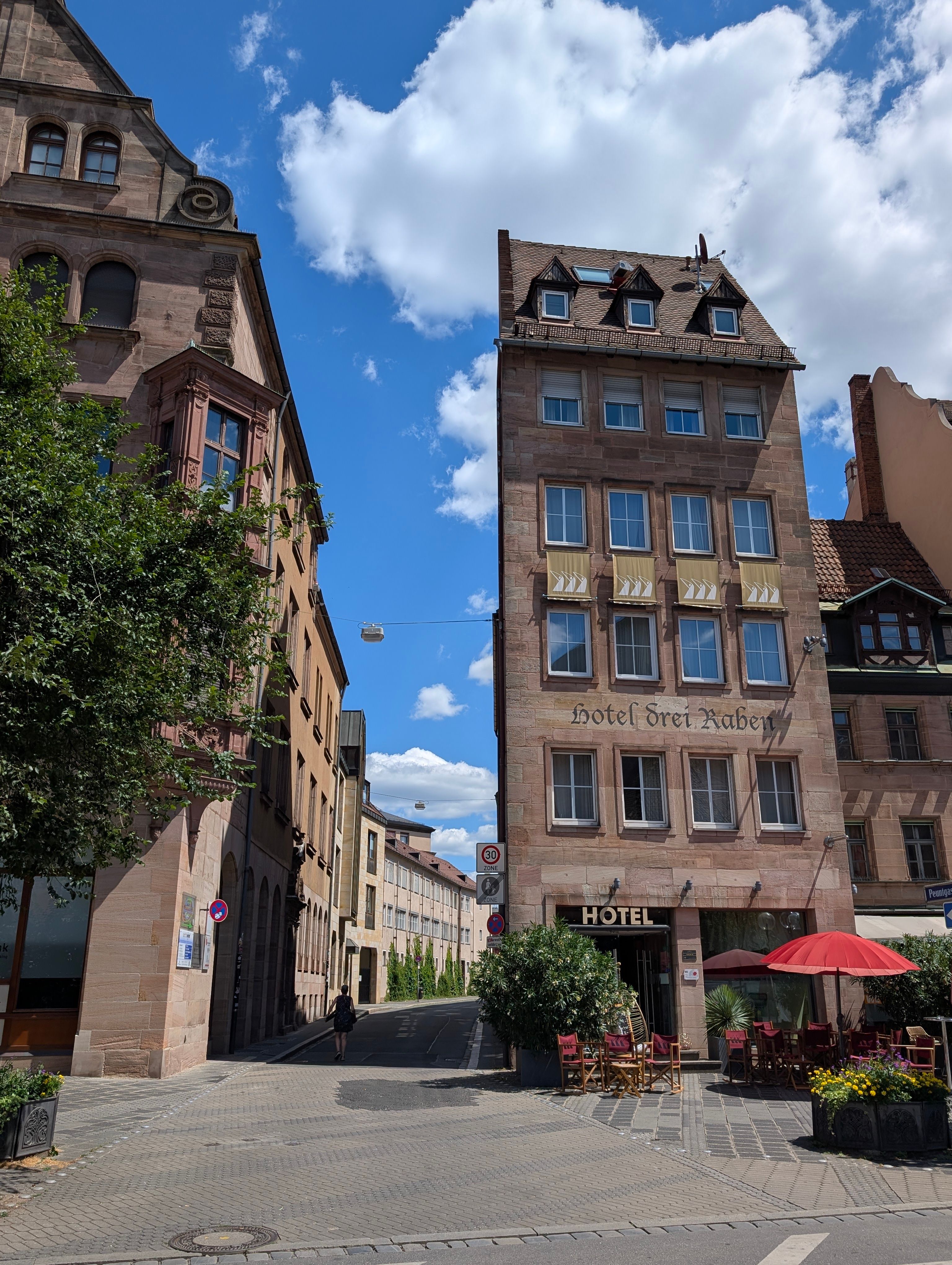 Historic architecture and cozy cafe setting in Nuremberg on a sunny day.
