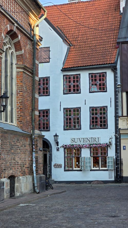 Free Quaint European street with a traditional souvenir shop and historic architecture. Stock Photo