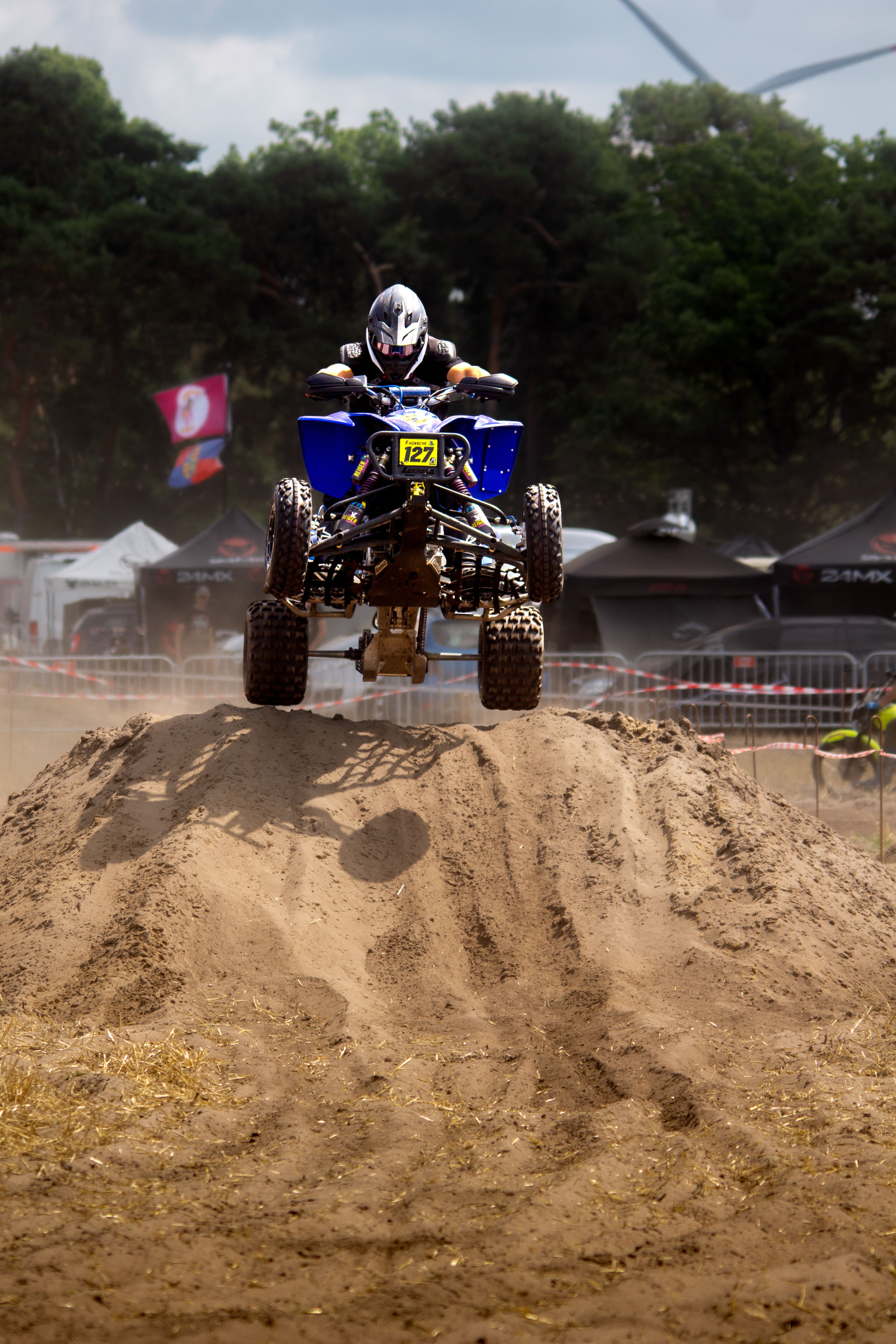 Exciting moment captured as an ATV rider performs a daring jump at Schönwald race track.