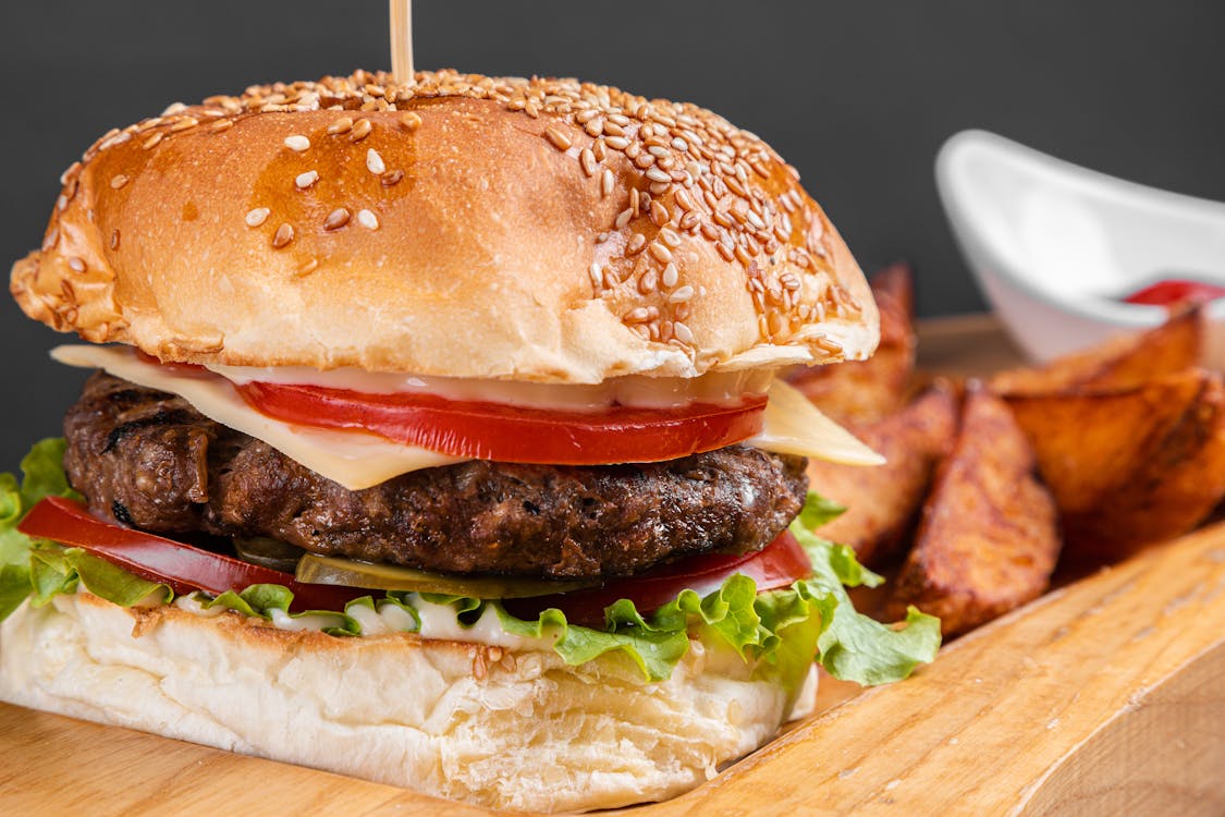 Burger With Lettuce And Tomato · Free Stock Photo