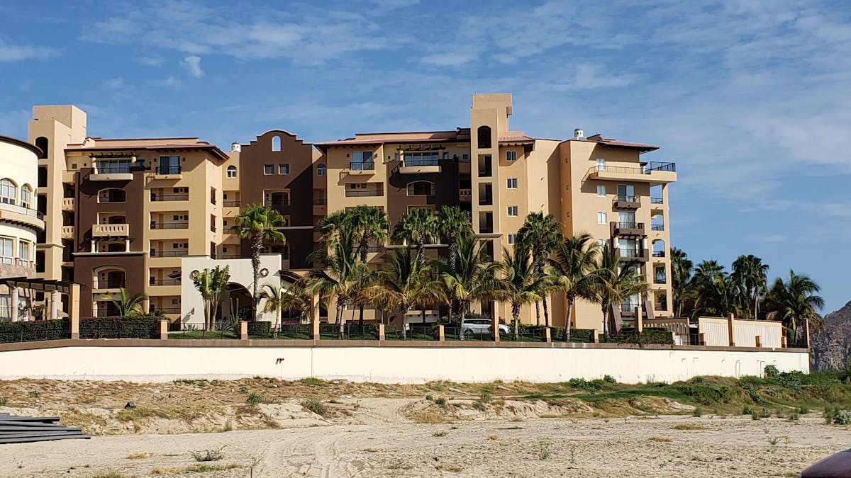 Raw chicken breasts marinating with herbs, olive oil, and lemon