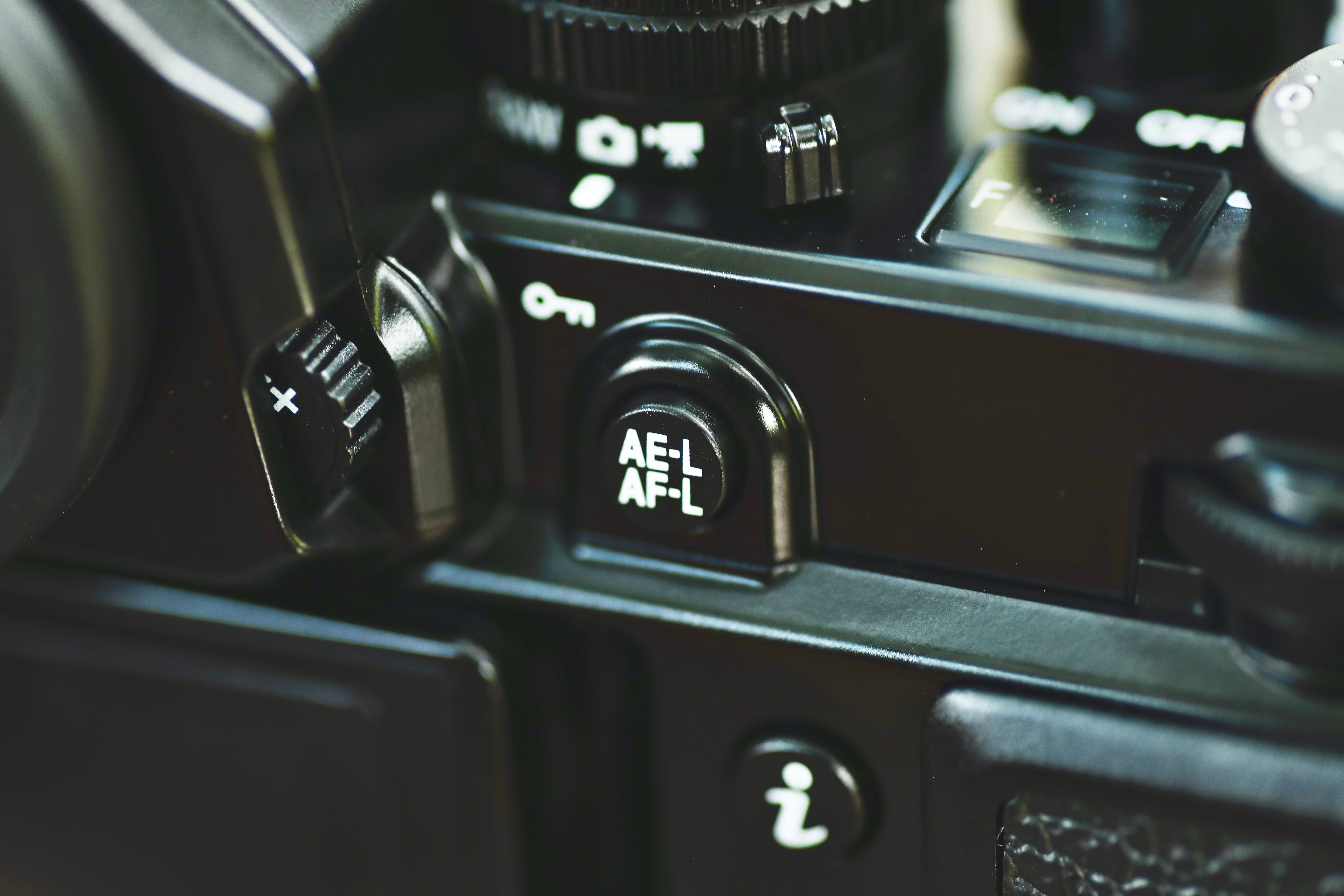 Detailed view of a camera's AE-L AF-L button, showcasing intricate design and structure.