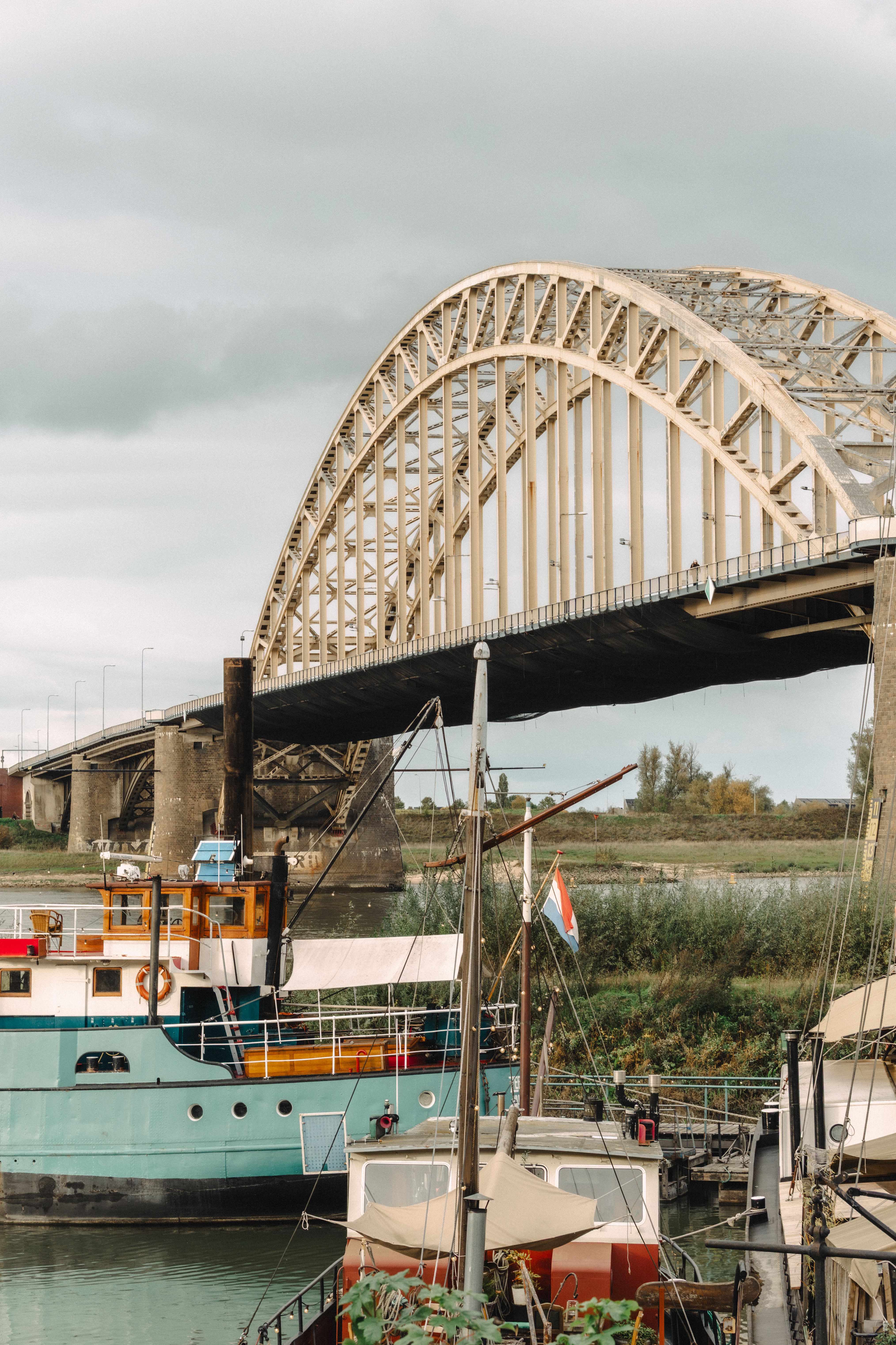 View of Nijmegen Bridge spanning over a harbor in Gelderland, Netherlands.