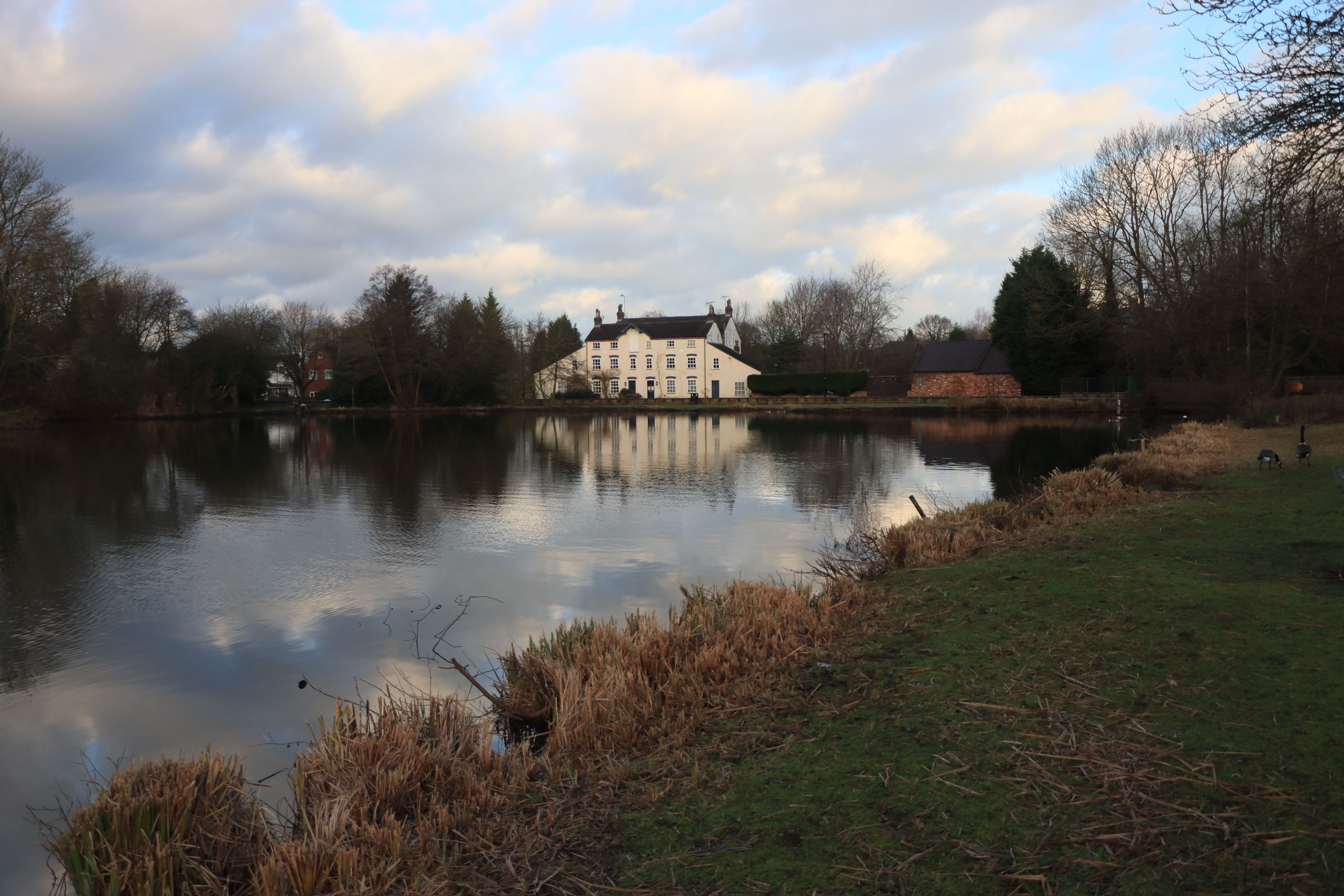 Scenic view of British countryside with historic manor house