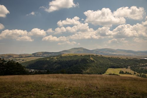 Free Beautiful rolling hills and vast sky in Zlatibor, Serbia, captured on a sunny day. Stock Photo