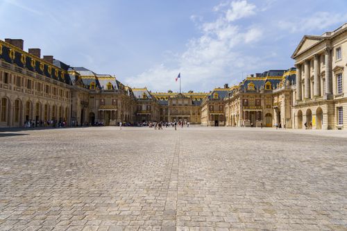 Free Explore the stunning architecture of the Palace of Versailles on a sunny day in Paris, France. Stock Photo