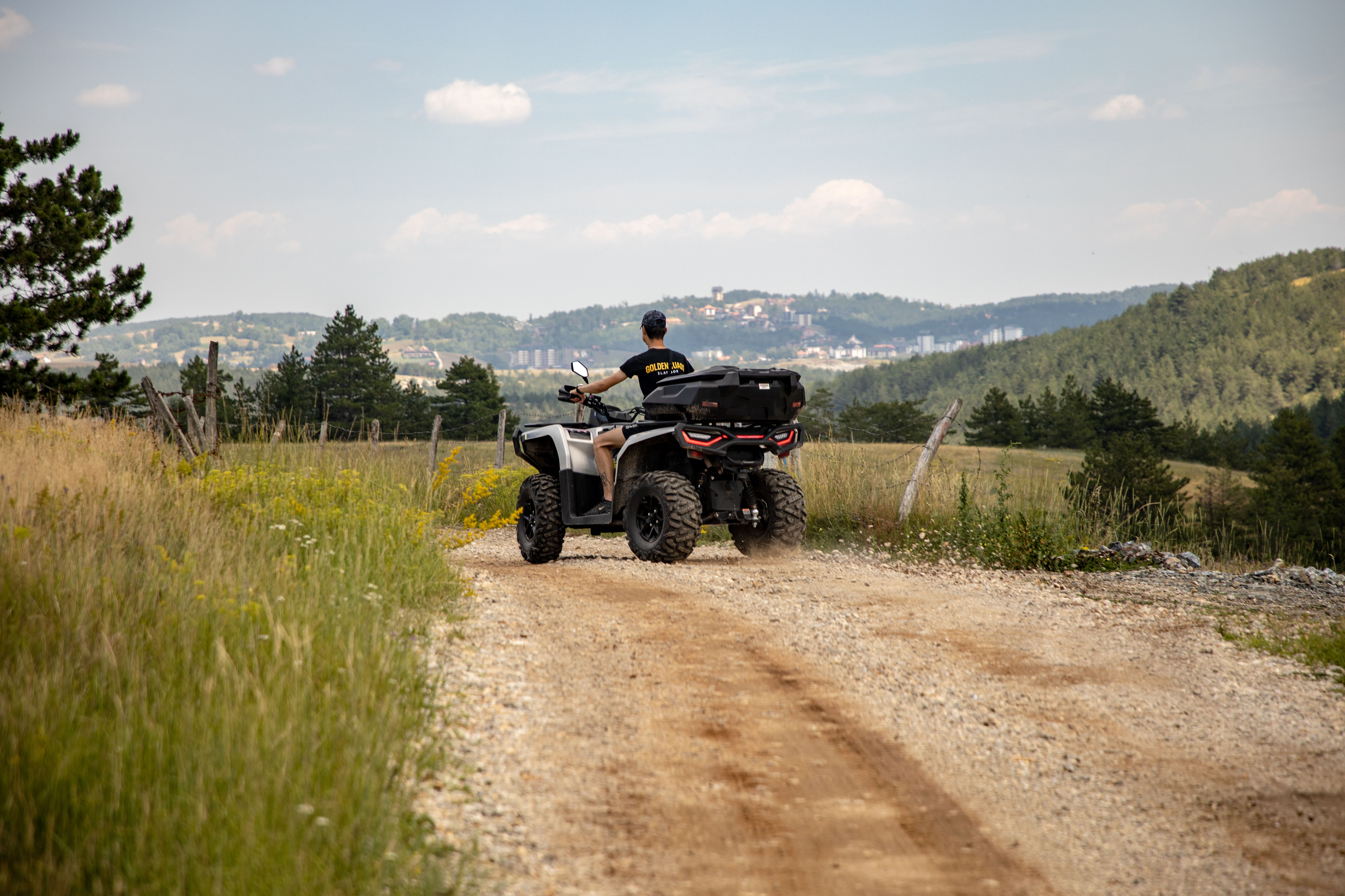 ATV rider exploring the picturesque Zlatibor countryside, Serbia's breathtaking landscapes.