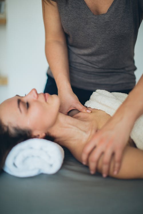 A Woman Lying on the Bed with Her Eyes Closed