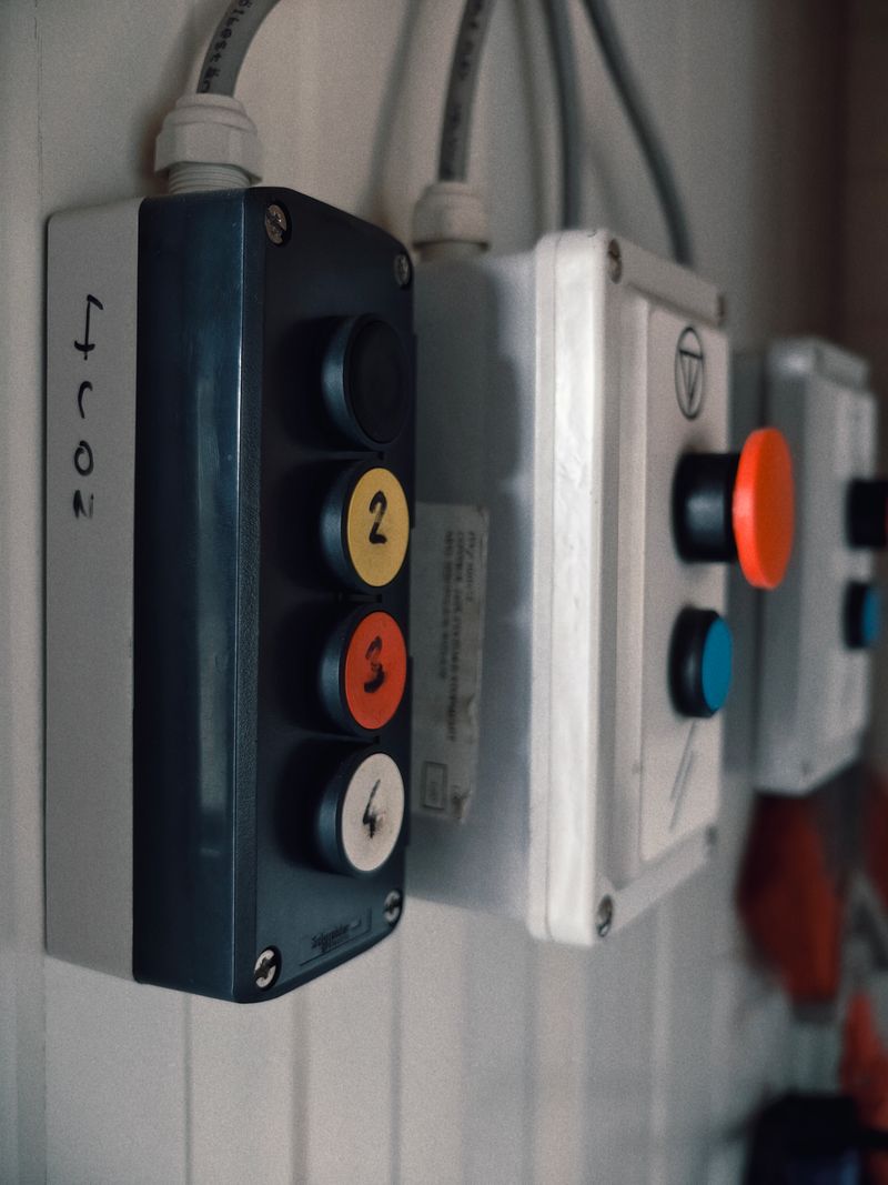 Industrial control panel with labeled buttons.