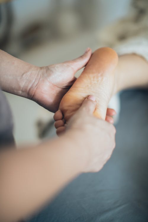 A Person Holding a Foot