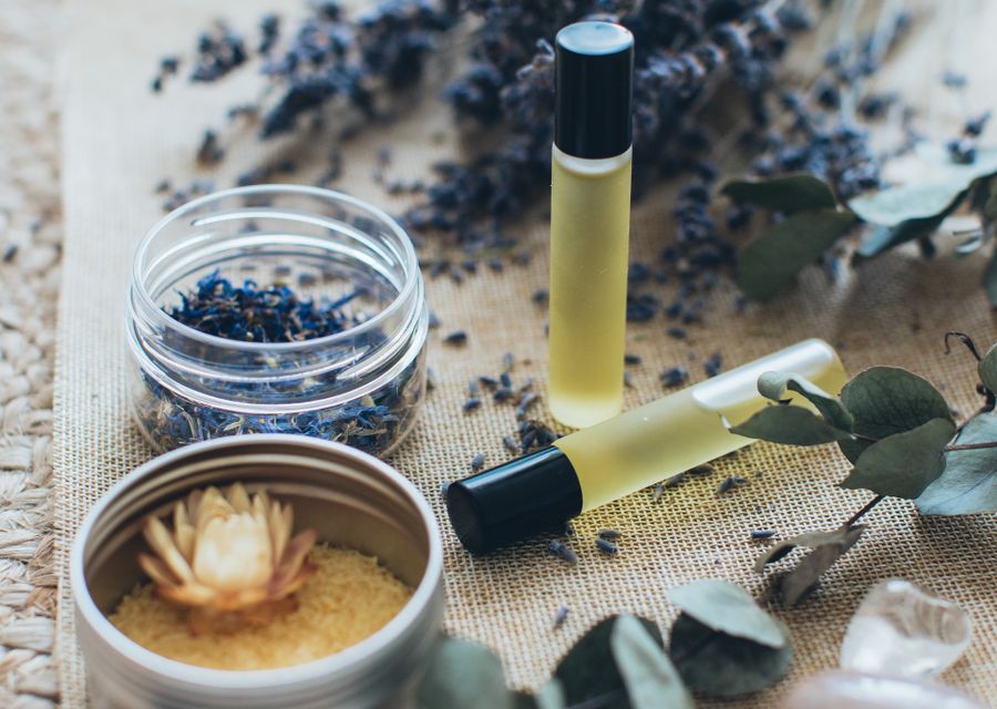 Essential oils, lavender and candles on a spa table