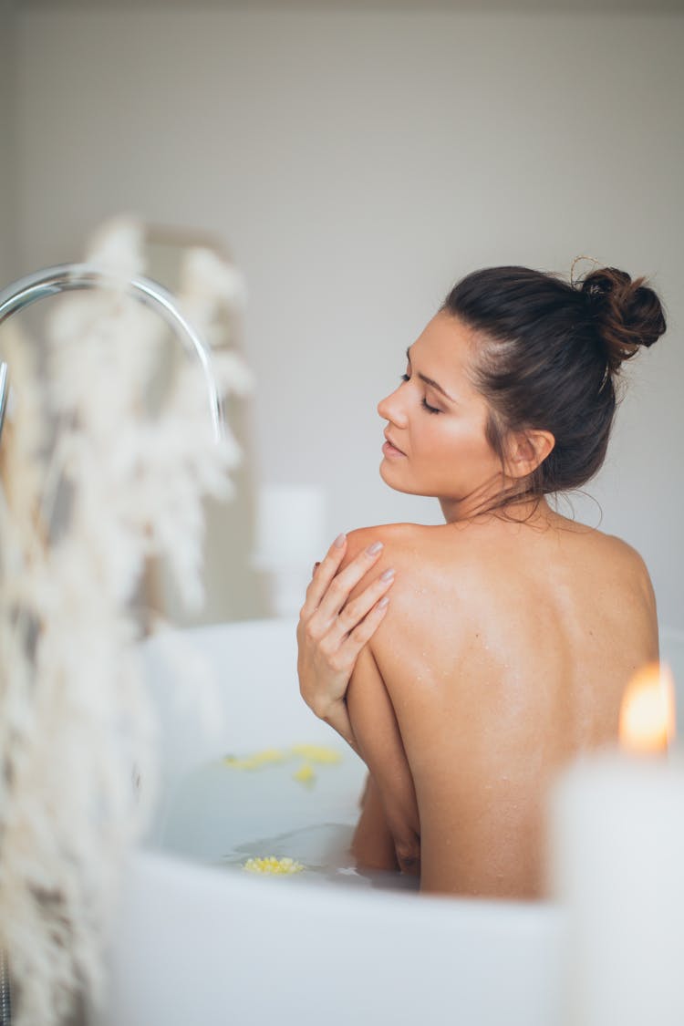 Topless Woman In Bathtub With Water