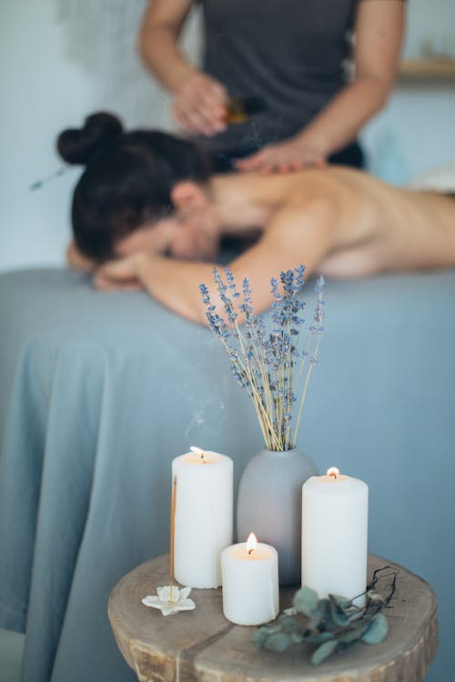 Lighted Candles and Incense on Wooden Stool