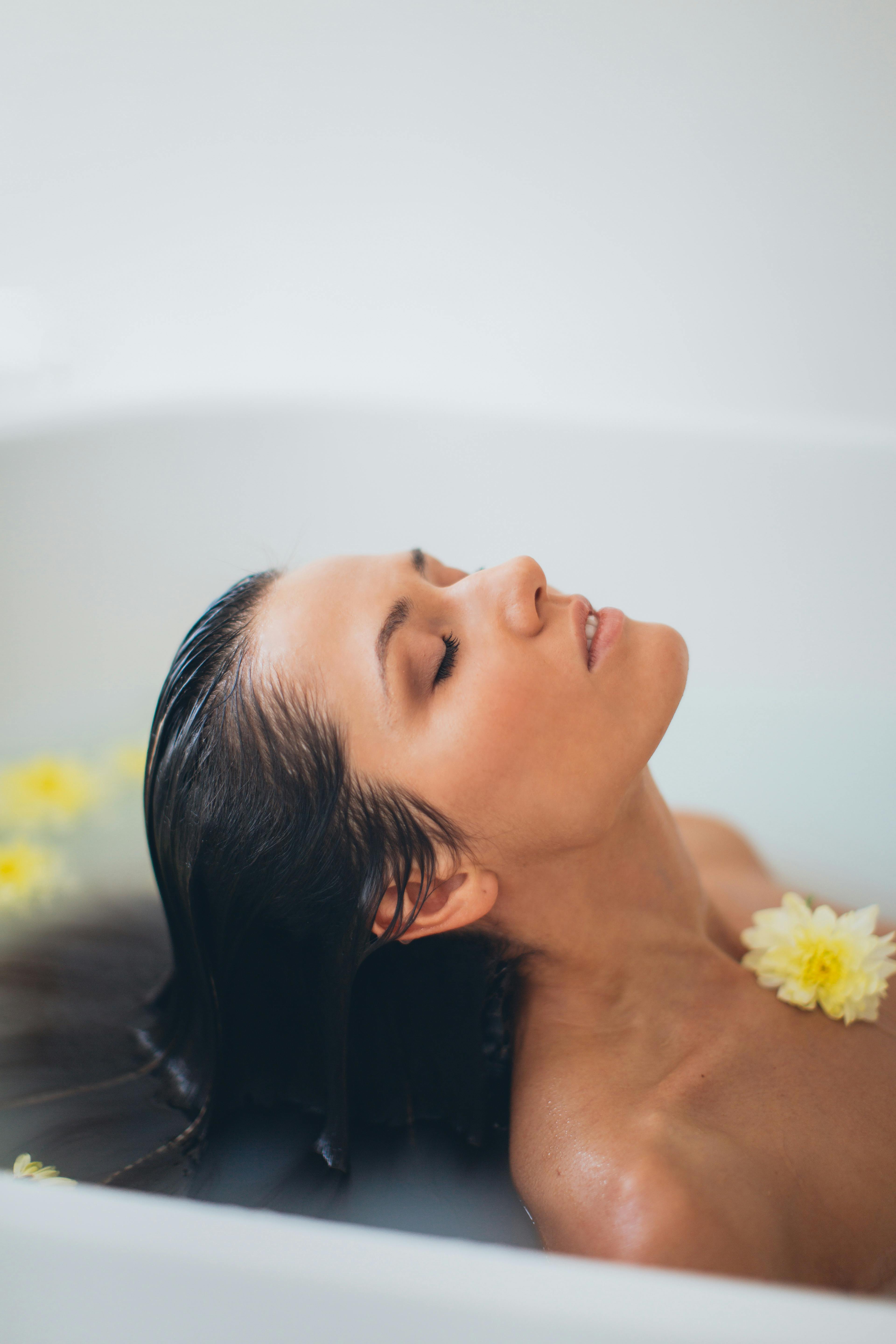 a woman with flower on her chest