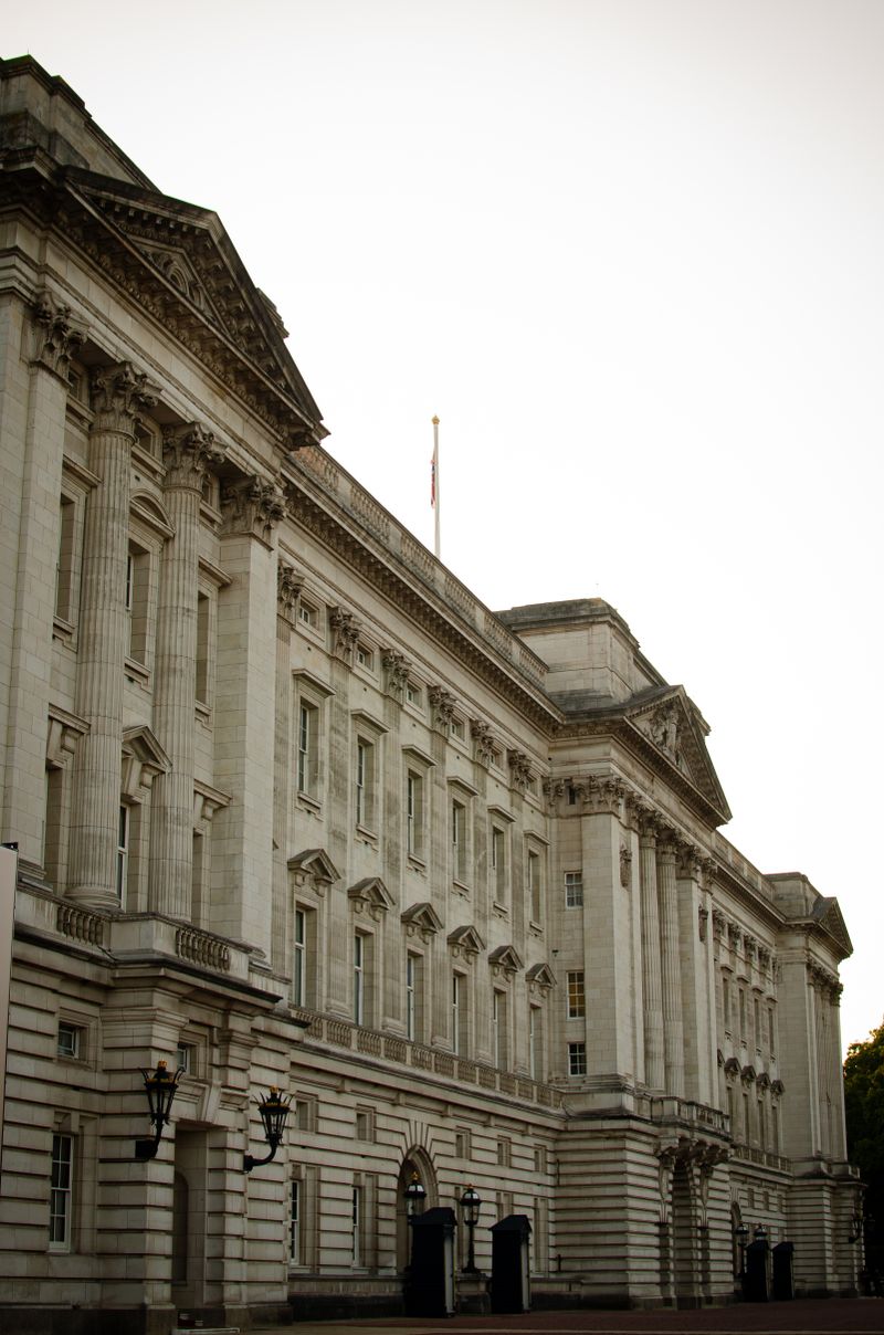The neoclassical facade of Buckingham Palace with its grand balcony