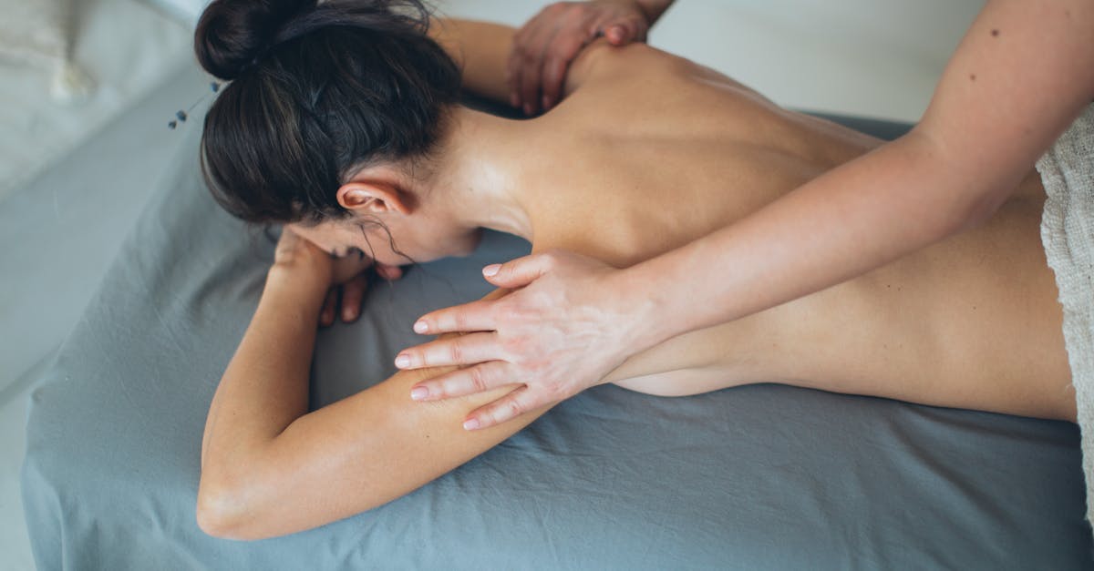 A woman receiving a relaxing back massage at a spa.