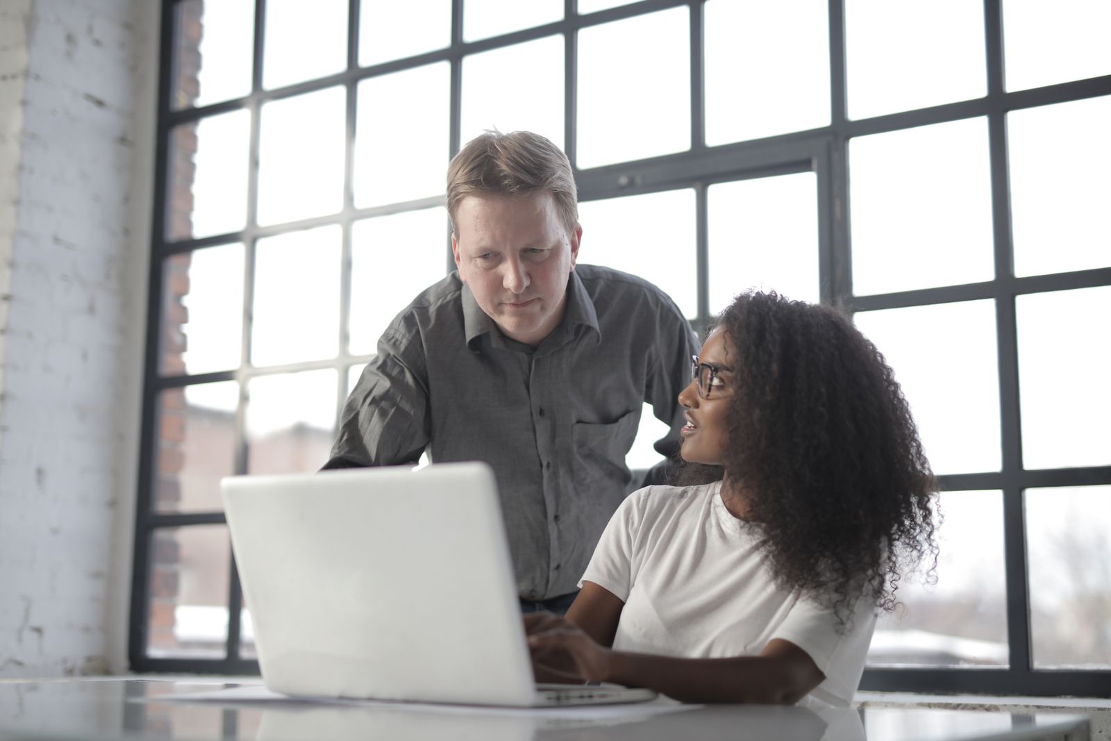 Colleagues working together at a table during a partnership discussion