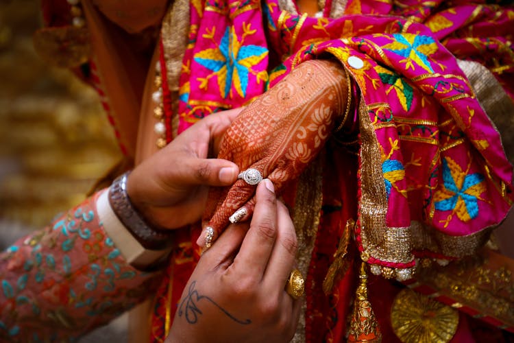 Crop Indian Man Giving Ring To Woman During Traditional Wedding Ceremony