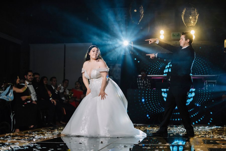 Guests celebrating on a dance floor beneath festival lights