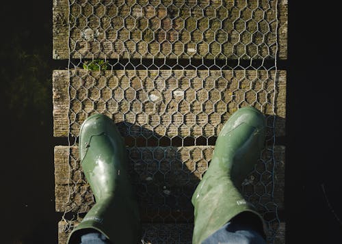 Person Wearing Green Boots